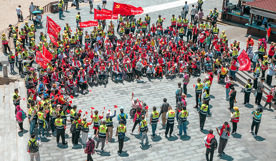 Arrampicata su sedia a rotelle
